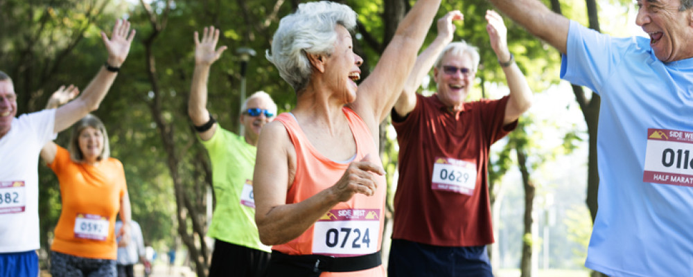 Groupd 70 year olds celebrating during a running race