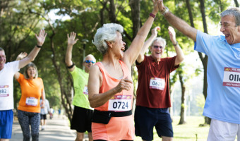 Groupd 70 year olds celebrating during a running race