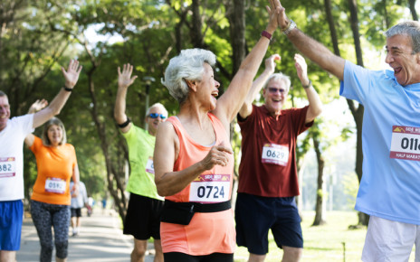 Groupd 70 year olds celebrating during a running race