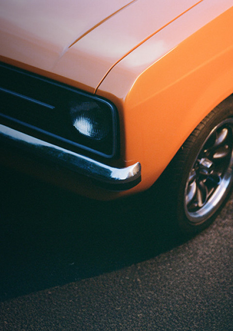 Detail of the front of an orange vintage car