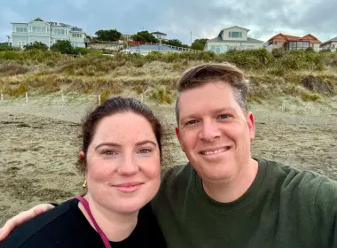 Georgia and her partner with a dunes background