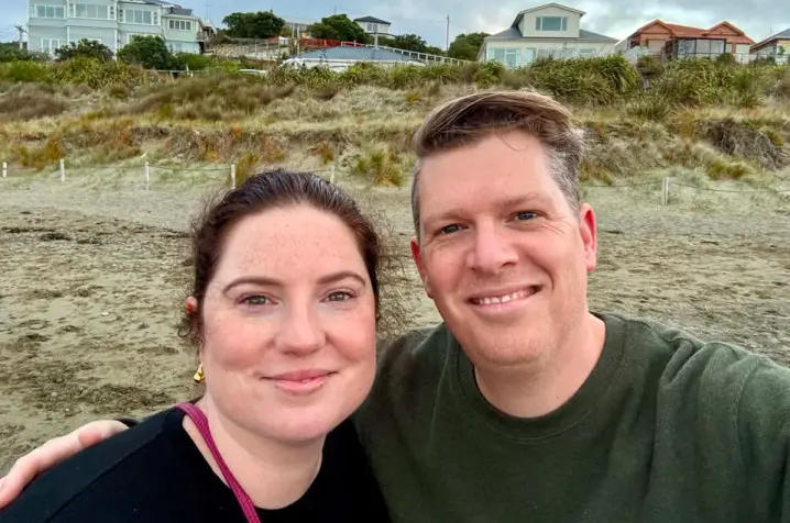 Georgia and her partner with a dunes background