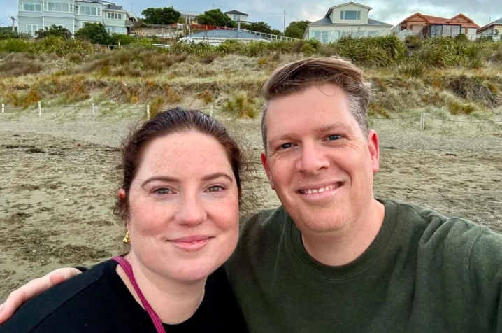 Georgia and her partner with a dunes background