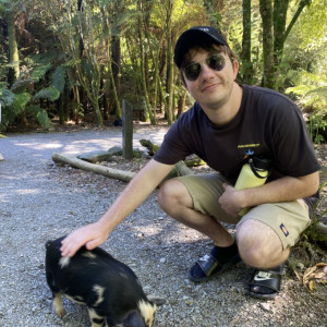 Matt patting a small dog