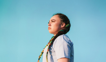 Women looking strong and confident over blue background