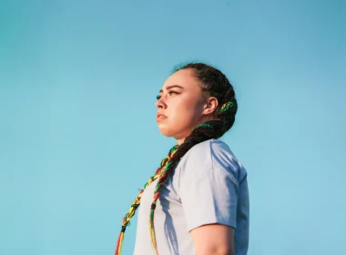 Women looking strong and confident over blue background