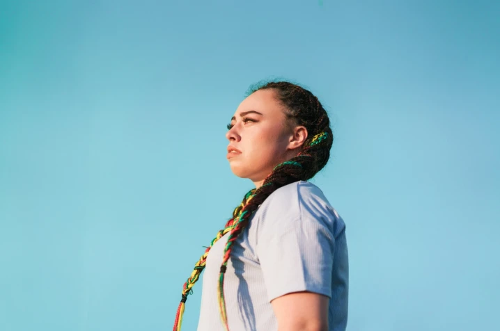 Women looking strong and confident over blue background