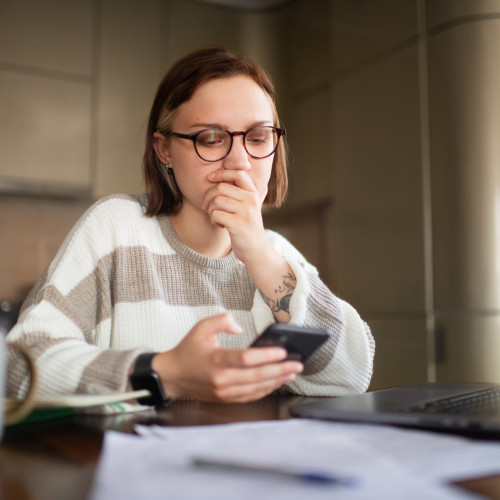 image womanlookingatphone hero