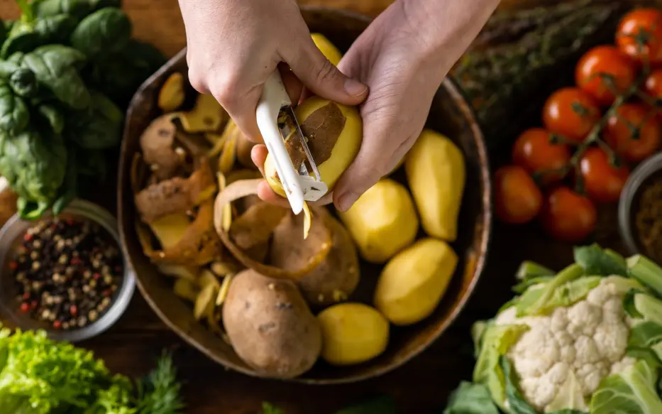Hand peeling potatoes 